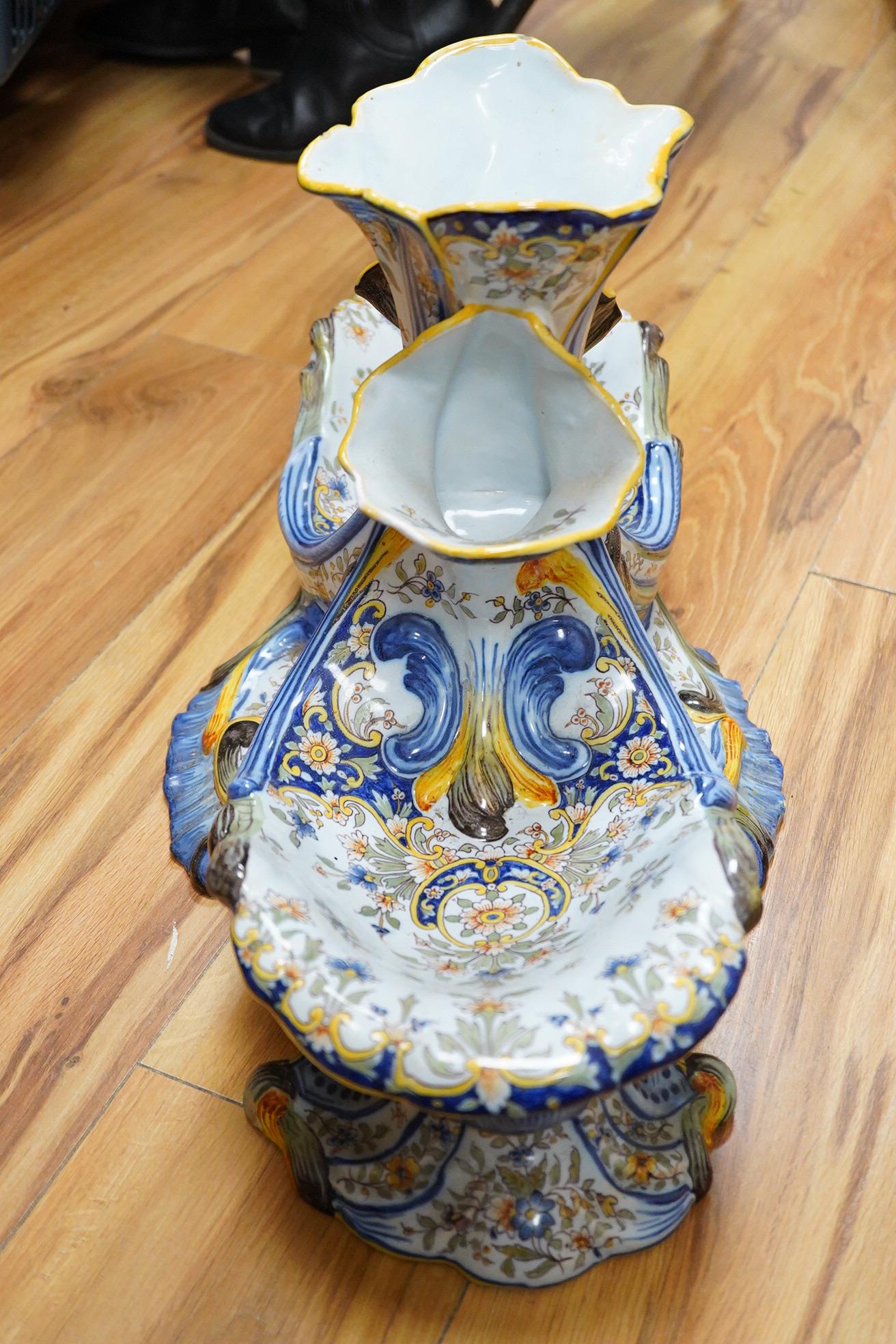 A large decorative French faience shell shaped centrepiece with central vase sections for flowers, 33cm high